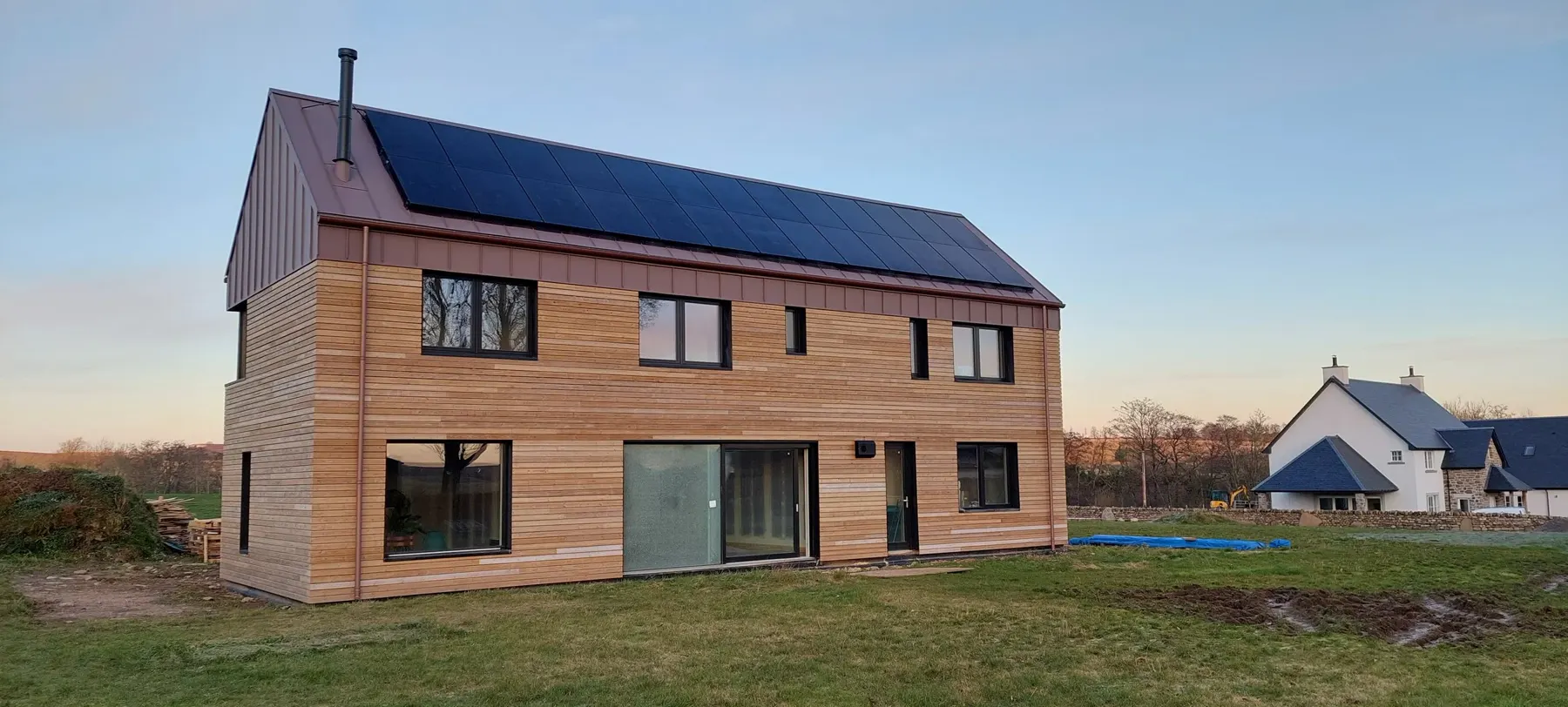 Long elevation of pre-weathered thermal pine cladding