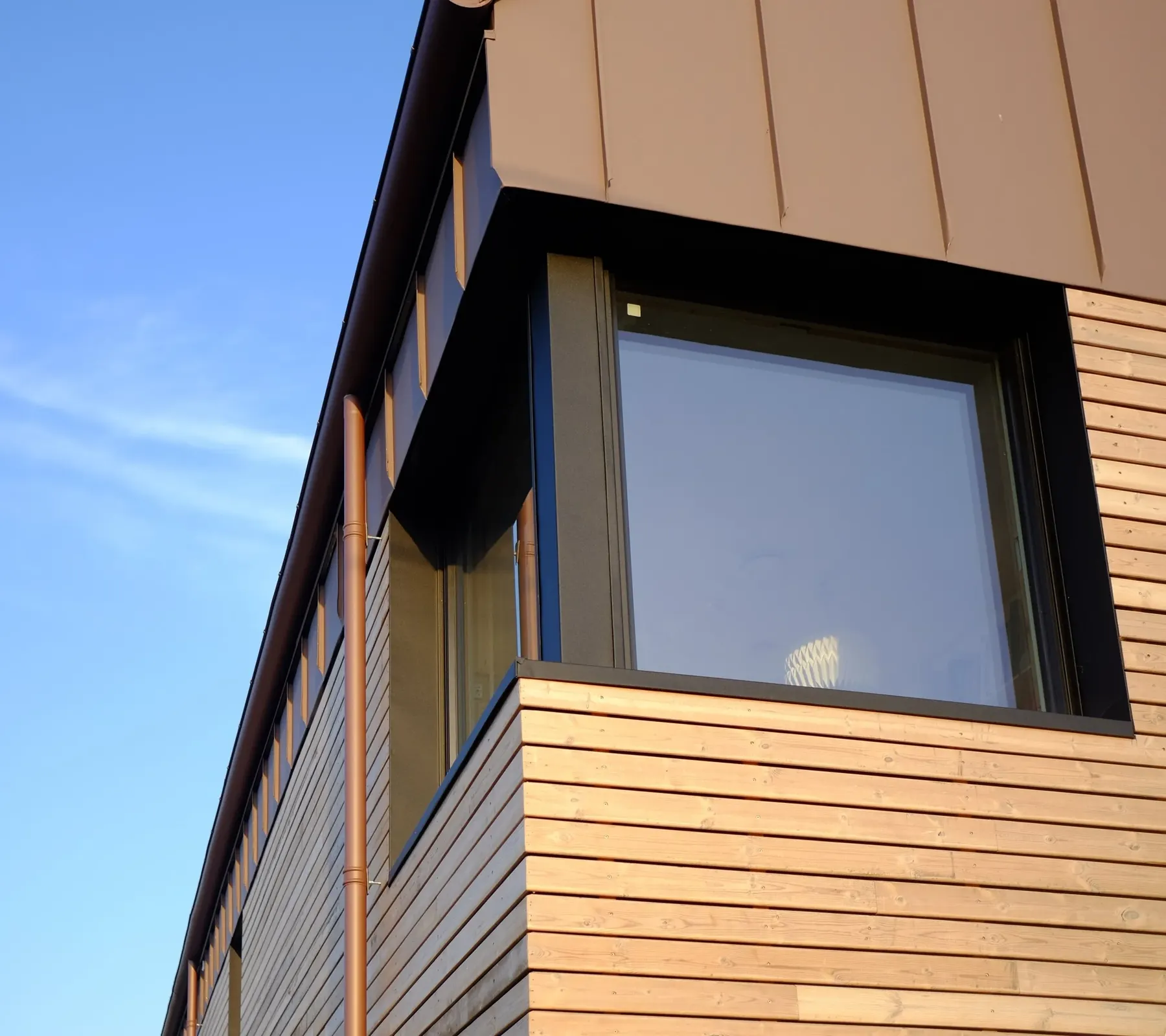 Cladding detail at a window reveal