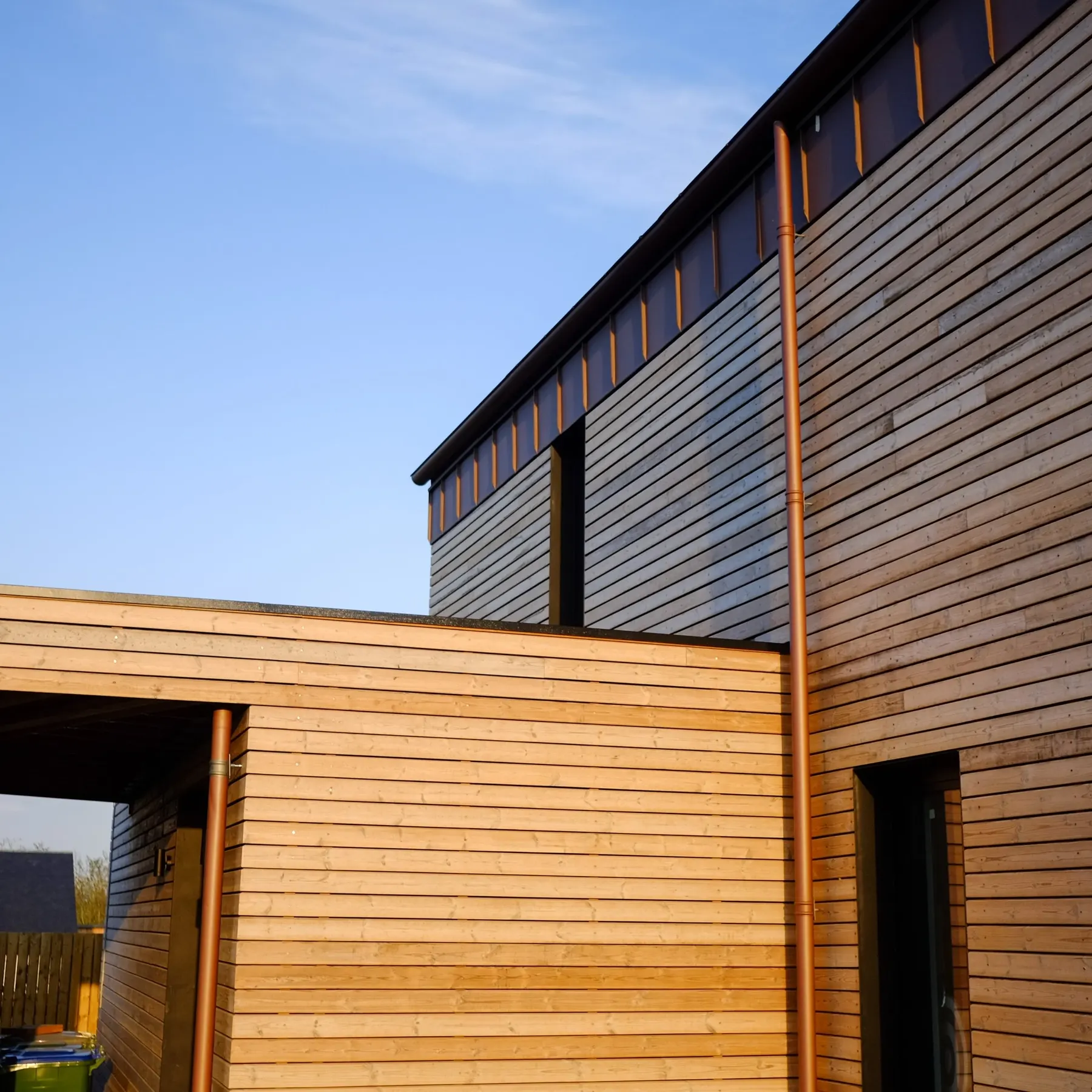 Corner detail of silvered timber boards