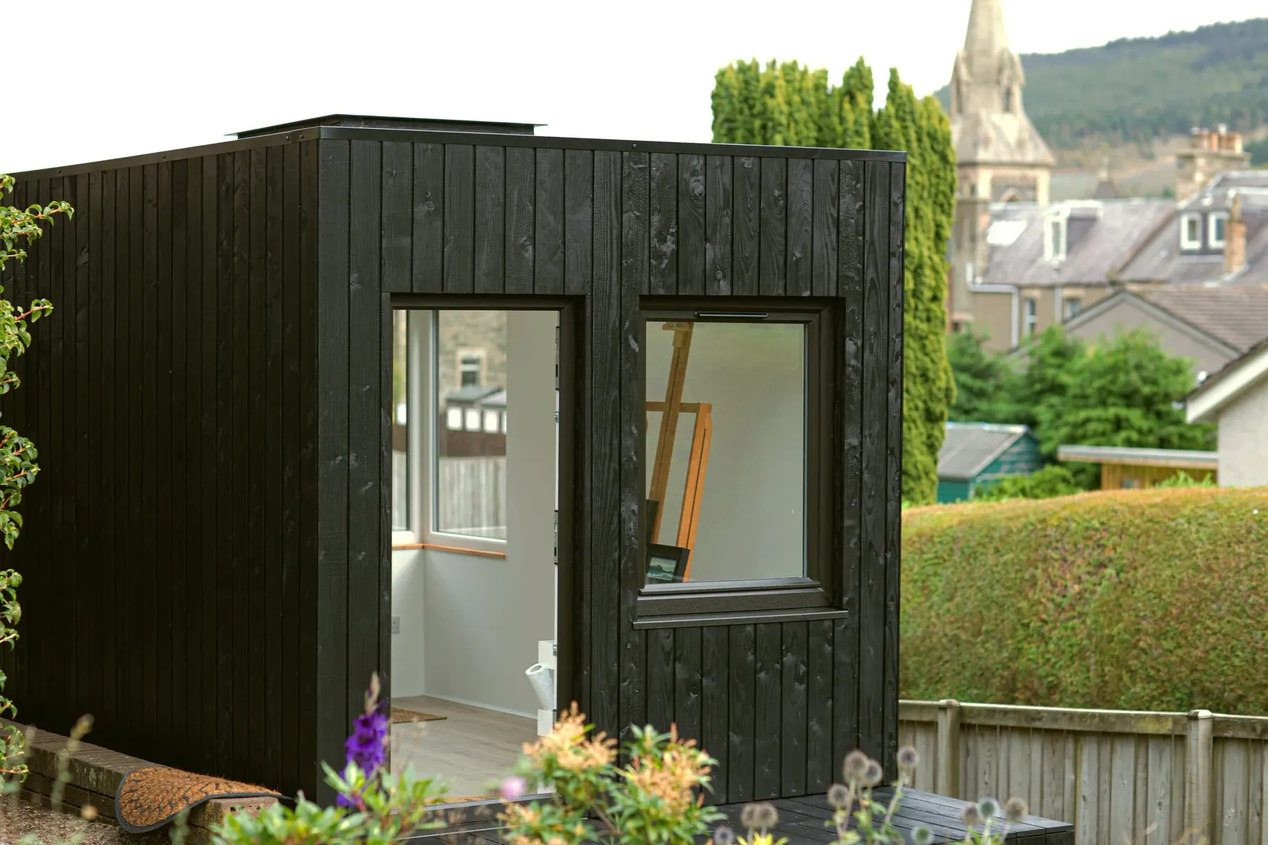 Shou Sugi Ban charred art studio in a garden at Innerleithen